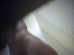 A suntanned girl is wiping her sexy body after shower