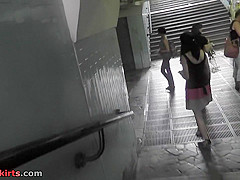 Amateur brunette shows off g-string in candid upskirts
