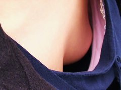 Asian sweetie lets a peek down her blouse