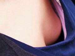 Asian sweetie lets a peek down her blouse