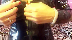 Babe in tight black PVC suit