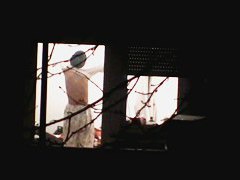 Beautiful Chinese girl exposes her body through the window