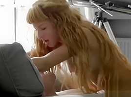 Beautiful long-haired redhead rides a stiff member