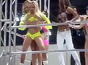 Big breasted women in bikinis and leather pole dancing