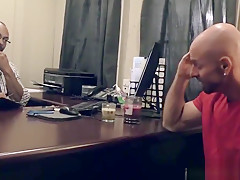 Black doctor removing something from the ass of a white guy