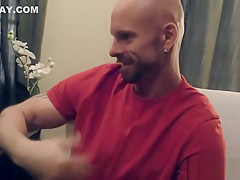 Black doctor removing something from the ass of a white guy