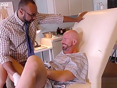 Black doctor removing something from the ass of a white guy