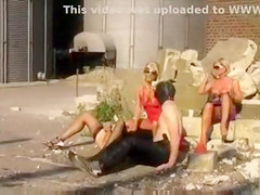 Blondes piss on slave men in kinky outdoor scene