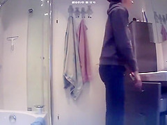 Chick undressing her clothes in bathroom