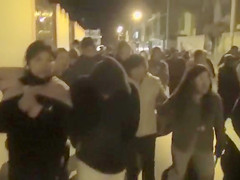 Cops walk a nearly naked criminal down the street