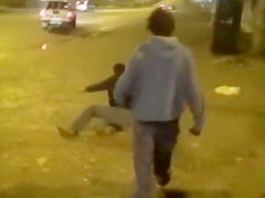 Cops walk a nearly naked criminal down the street