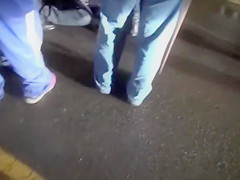 Cops walk a nearly naked criminal down the street