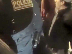Cops walk a nearly naked criminal down the street
