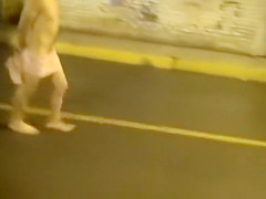 Cops walk a nearly naked criminal down the street