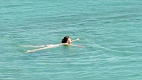 Couple fucked on a public beach while as people walked near