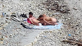 Couple fucked on a public beach while as people walked near