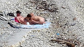 Couple fucked on a public beach while as people walked near