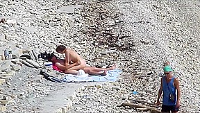 Couple fucked on a public beach while as people walked near