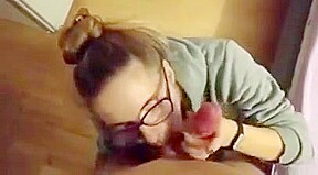 Cute blonde girl with glasses sucks dick