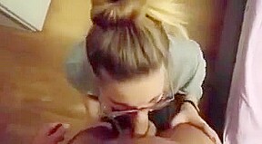 Cute blonde girl with glasses sucks dick