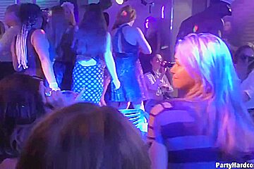 Dark haired woman is kneeling in front of her horny guy and sucking his cock, during a party