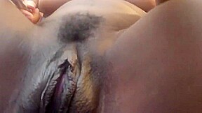 Ebony playing and squirting