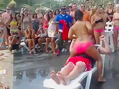 Fat guy gets a wild lap dance from topless girl