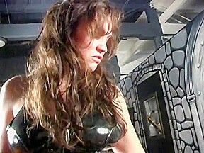 Female fucks male with strapon in latex