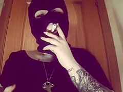 Girl With A Mask Plays With Her Tits And Smokes A Cigarette
