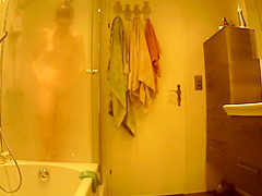 Hairy beauty spied in the shower