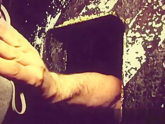 He gets blown and jerked through the gloryhole in the sexshop