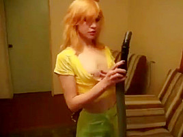 Hot skinny redhead playing with the vacuum