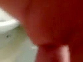 Jerking cock in bathroom