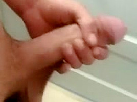 Jerking cock in bathroom