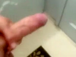 Jerking cock in bathroom