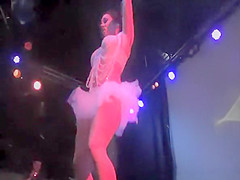 Live public strip show at erotic fair