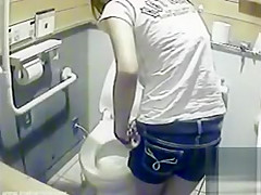Lovely Japanese girls pee in a public toilet