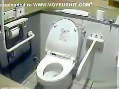 Lovely Japanese girls pee in a public toilet