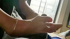 Milf Give a Footjob in a Hotel