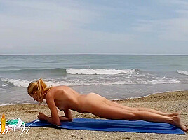 Nude Yoga Workout Of A Beautiful Blond Woman With Nice Tits And Perfect Pussy On The Beach
