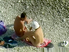 Nudist woman wanks her nude man's penis