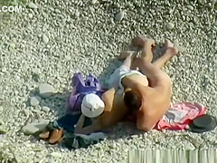 Nudist woman wanks her nude man's penis