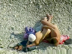 Nudist woman wanks her nude man's penis