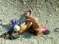 Nudist woman wanks her nude man's penis
