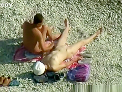 Nudist woman wanks her nude man's penis