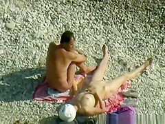 Nudist woman wanks her nude man's penis