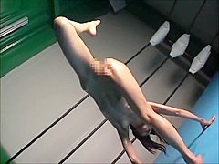 Oiled asian Gymnast Stretching