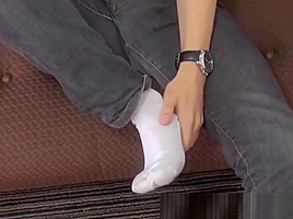 Perverted twink licks his feet and strokes his thick cock