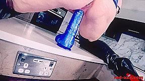Red XXX shows off in her blue latex dress