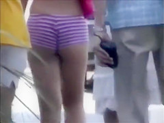 Saucy blonde babe walks around the town wearing revealing clothes